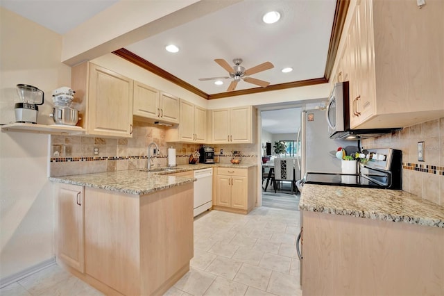 kitchen with white dishwasher, light stone counters, and light brown cabinetry