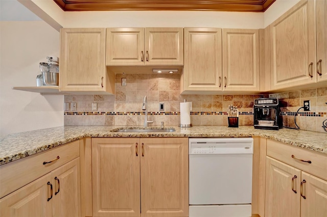 kitchen featuring white dishwasher, sink, light brown cabinetry, and tasteful backsplash