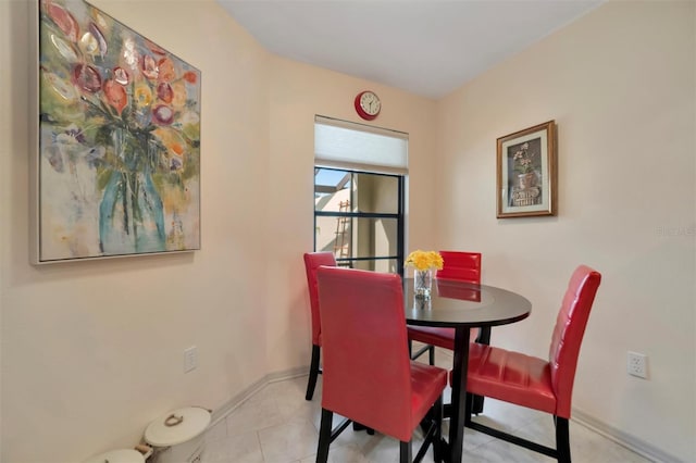 dining area featuring light tile patterned floors