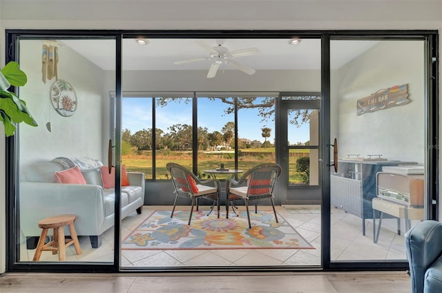 entryway with ceiling fan and a healthy amount of sunlight