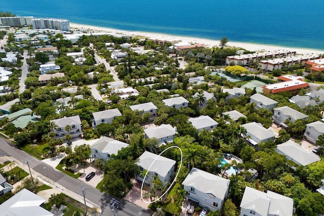 bird's eye view featuring a beach view and a water view