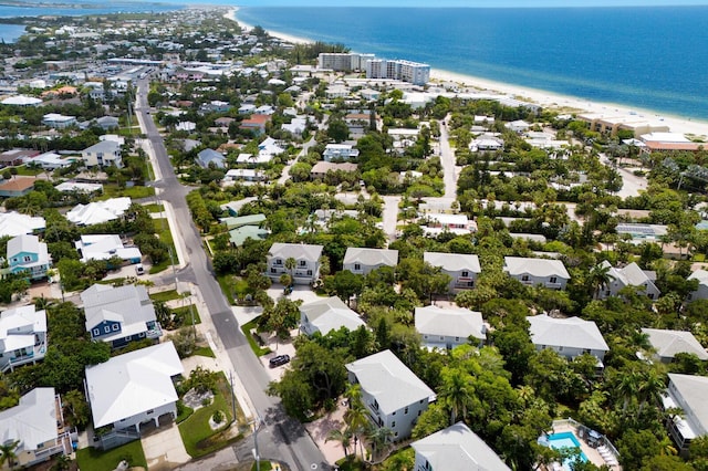 birds eye view of property with a view of the beach and a water view