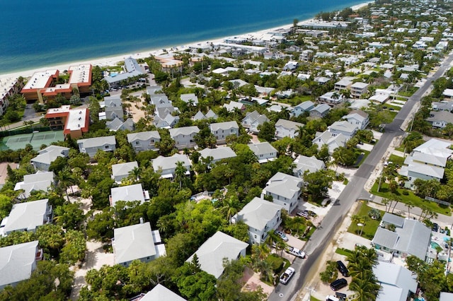 drone / aerial view featuring a view of the beach and a water view