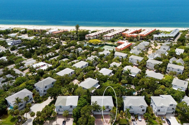 bird's eye view with a beach view and a water view