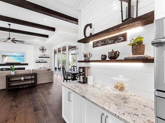 bar featuring light stone countertops, dark wood-type flooring, white cabinetry, and beamed ceiling