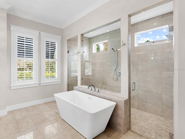 bathroom featuring tile patterned floors and shower with separate bathtub