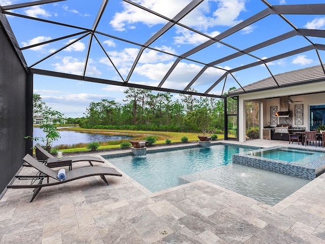 view of pool with a patio area, an in ground hot tub, pool water feature, glass enclosure, and a water view