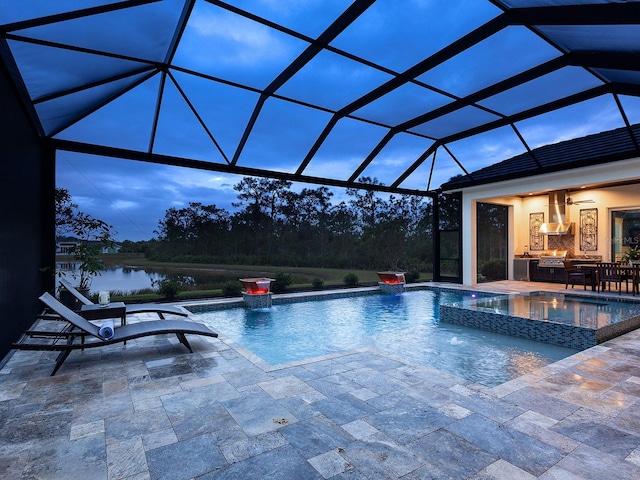 pool at dusk with a patio area and glass enclosure