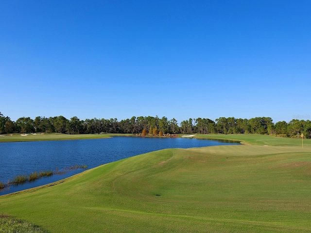 surrounding community with a water view