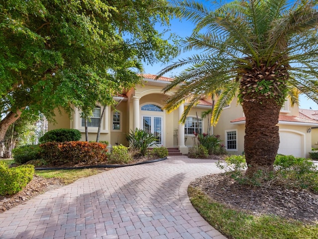 mediterranean / spanish-style home featuring french doors