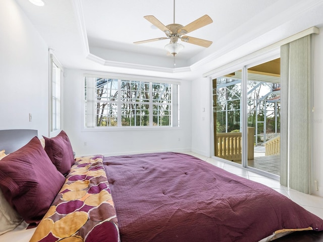 tiled bedroom with access to outside, a raised ceiling, and ceiling fan