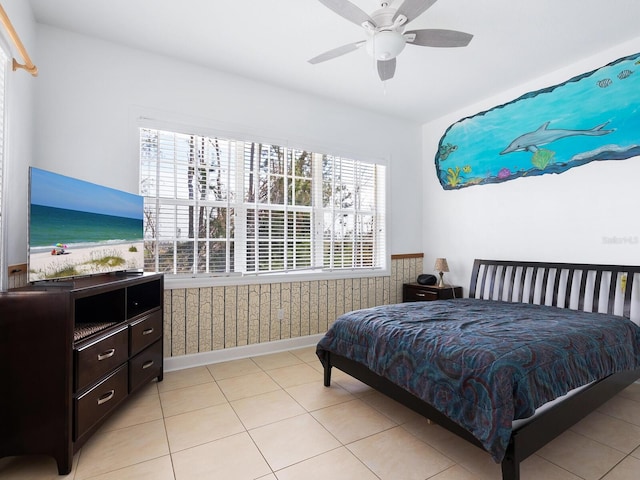 tiled bedroom with ceiling fan