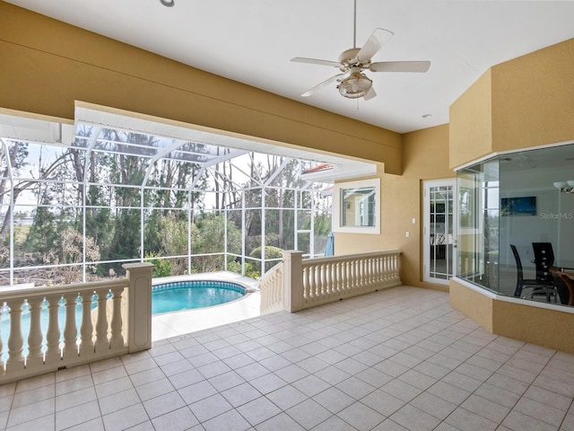 interior space with ceiling fan