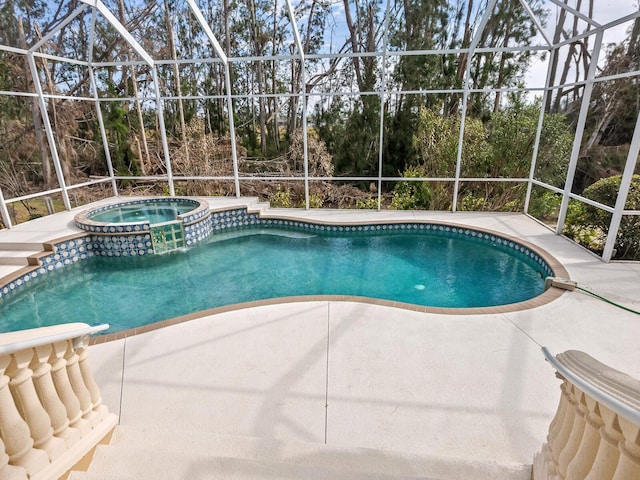 view of swimming pool with glass enclosure, an in ground hot tub, and a patio