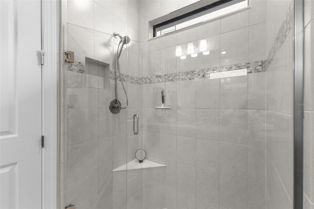 bathroom featuring an enclosed shower