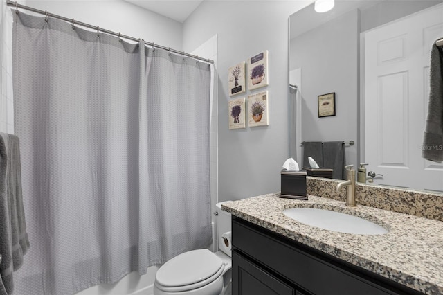 full bathroom featuring toilet, vanity, and shower / bath combination with curtain