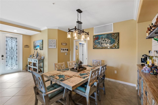 tiled dining space with crown molding