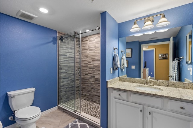 bathroom featuring a shower with door, tile patterned floors, toilet, and vanity