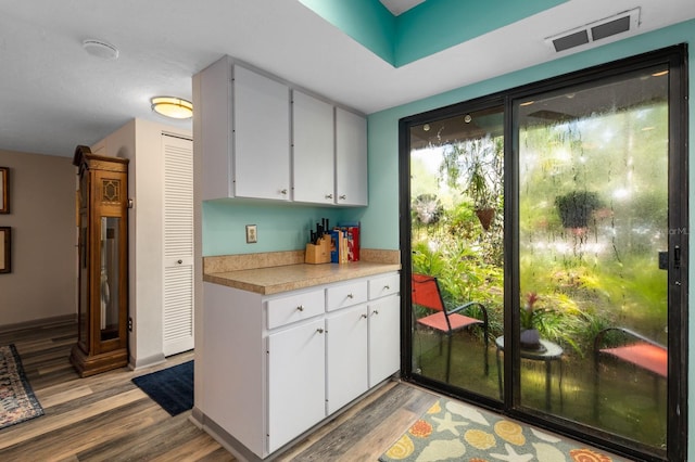 kitchen featuring white cabinetry and light wood-type flooring