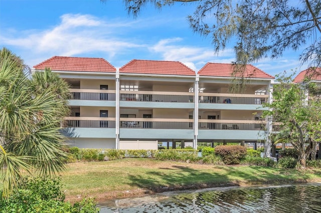 view of building exterior featuring a water view