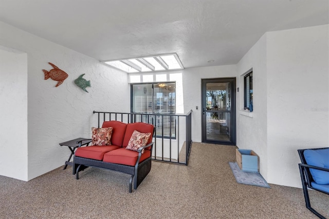 living area featuring carpet floors