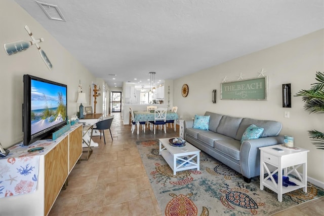 living room featuring an inviting chandelier