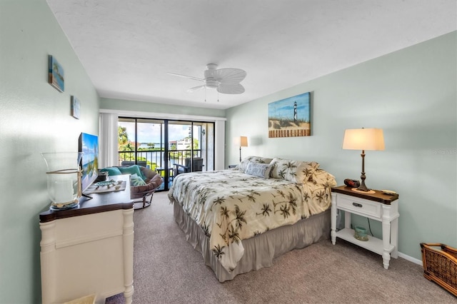 bedroom with ceiling fan, access to exterior, and light colored carpet