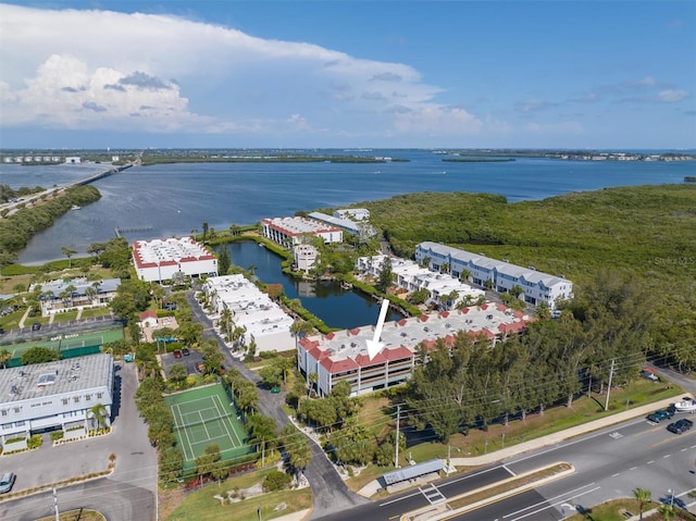 birds eye view of property with a water view