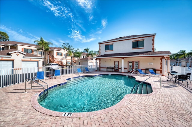 view of swimming pool featuring a patio area