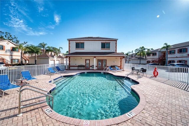 view of pool featuring a patio