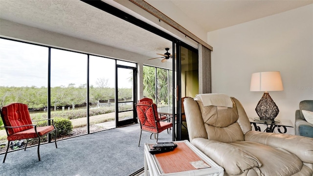 sunroom with ceiling fan