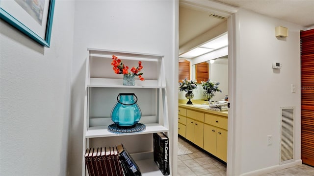 bathroom featuring vanity and tile patterned flooring