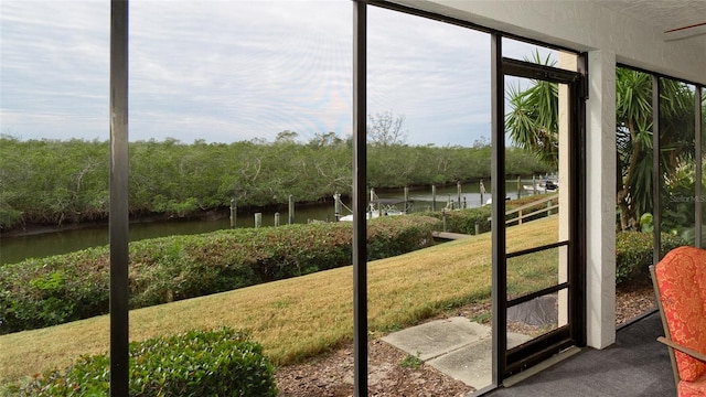 entryway with carpet flooring and a water view