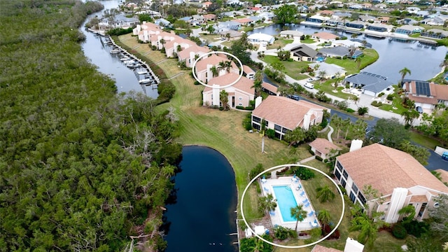 birds eye view of property featuring a water view