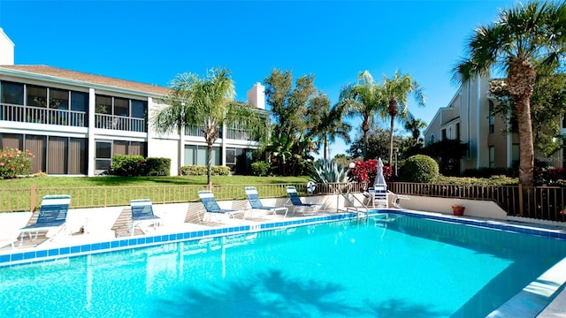 view of pool featuring a yard and a patio area