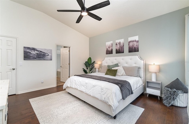 bedroom featuring dark hardwood / wood-style flooring, ceiling fan, and vaulted ceiling