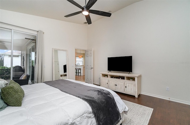 bedroom featuring ceiling fan, access to outside, lofted ceiling, and dark hardwood / wood-style floors