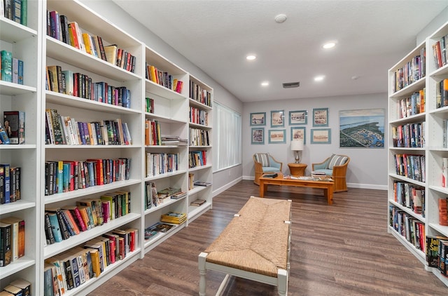 sitting room with dark hardwood / wood-style flooring