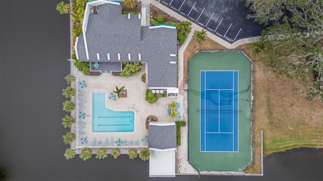 birds eye view of property with a water view