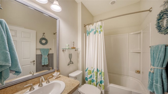 full bathroom featuring toilet, vanity, and shower / bathtub combination with curtain