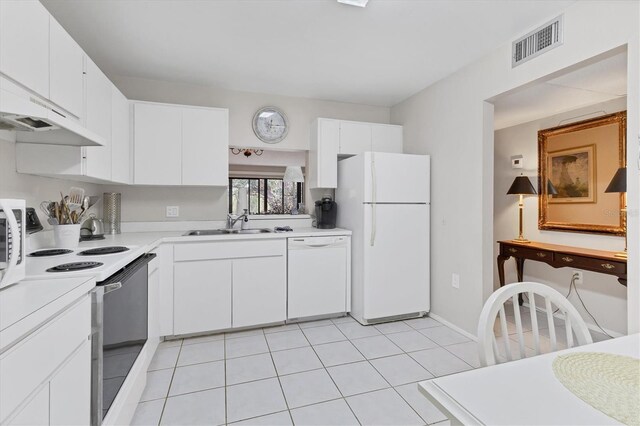 542 Lakeside Dr Unit 542, Bradenton, FL 34210 - kitchen with a sink, white appliances, light countertops, under cabinet range hood, and visible vents