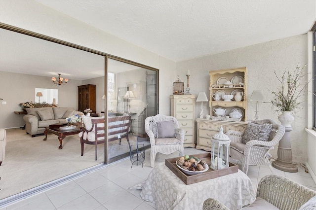 542 Lakeside Dr Unit 542, Bradenton, FL 34210 - tiled living area with an inviting chandelier and a textured ceiling