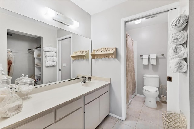 542 Lakeside Dr Unit 542, Bradenton, FL 34210 - full bath with tile patterned flooring, visible vents, toilet, vanity, and baseboards