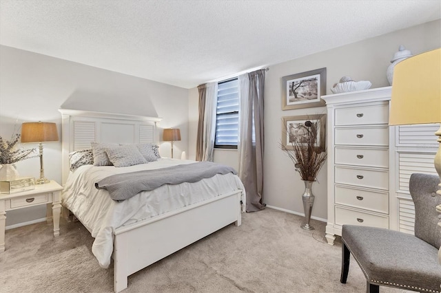 542 Lakeside Dr Unit 542, Bradenton, FL 34210 - bedroom featuring light carpet, a textured ceiling, and baseboards