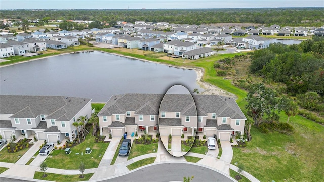 drone / aerial view with a water view