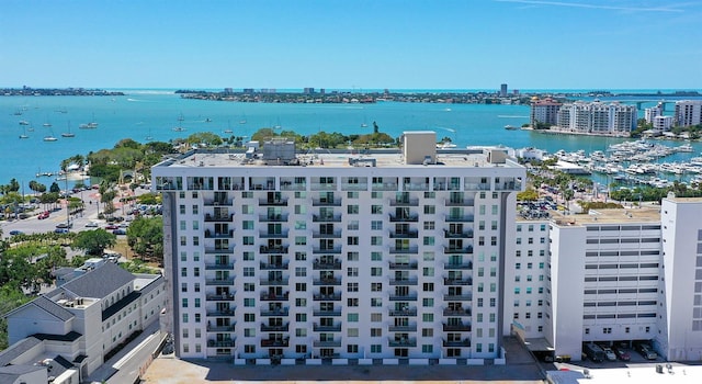 birds eye view of property with a water view