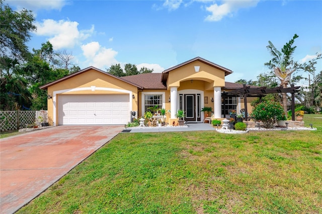 view of front of house with a front yard, a pergola, and a garage