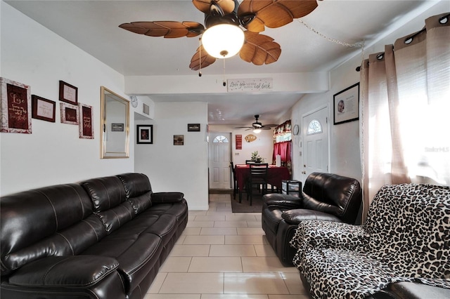 living room with ceiling fan and light tile patterned flooring