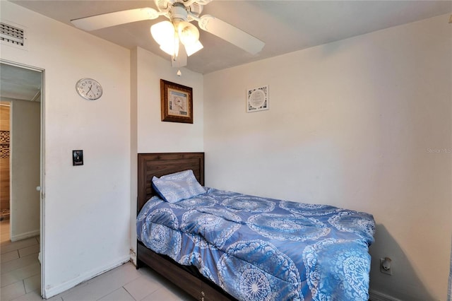 tiled bedroom with ceiling fan