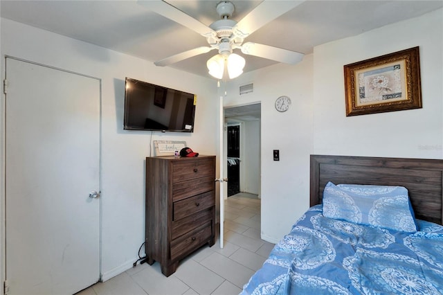 bedroom featuring light tile patterned floors and ceiling fan